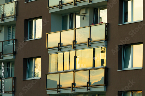 Quadro su tela This is a multistory building that features numerous large windows and several b