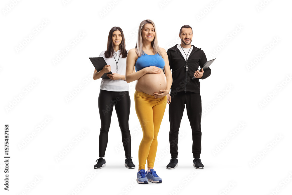 Fototapeta premium Pregnant woman with a male and female fitness trainers