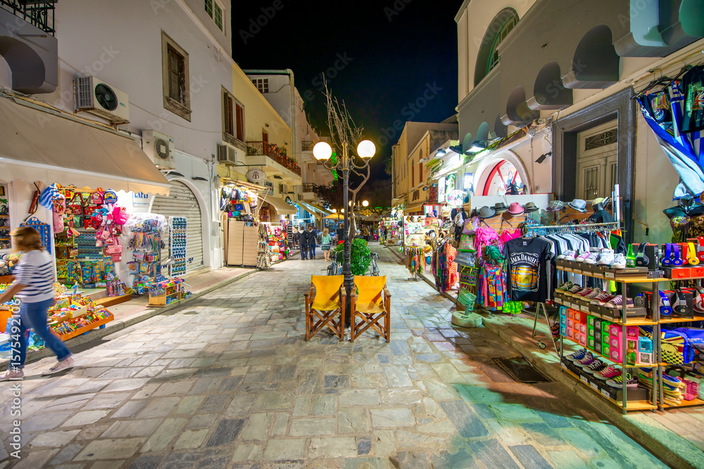 Obraz premium Kos, Greece - June 5, 2014: Cobblestone streets of Kos illumina