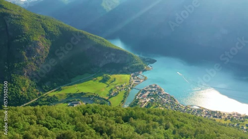 Majestic Aerial View of Turquoise Mountain Lake Surrounded by Lush Green Hills in Summer