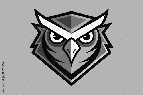 An owl with grayscale plumage confidently faces forward in an intimidating and geometric manner