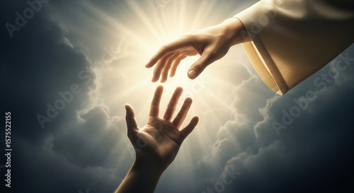Close-up of Jesus' hand saving a man's hand against the sky. Miracle of saving the life of Jesus Christ, the Son of God, salvation from a sinful life. Christmas, Easter, love, heaven and salvation 