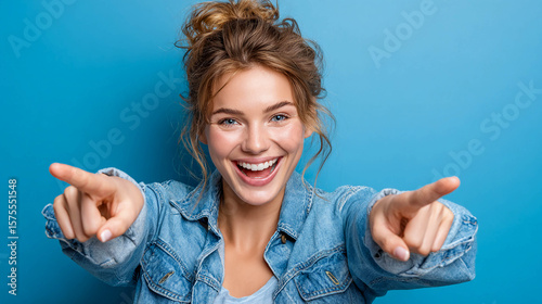A young woman holds her hands in front of her and shows two fingers, creating the 