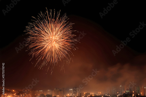Enchanting night sky filled with fireworks over a vibrant cityscape during New Year's Eve celebration