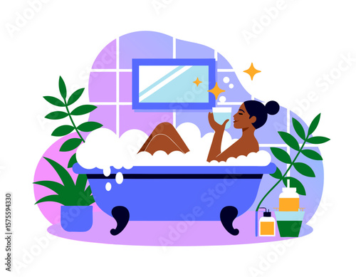 A woman relaxes in a bubble bath, holding a cup, in a serene bathroom setting.
