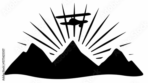 Silhouette of biplane flying over mountain range with sun rays emanating from behind the peaks in black and white