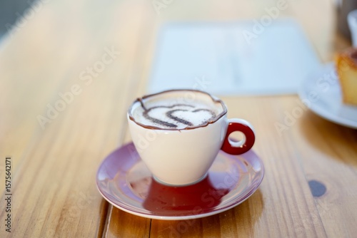 Cappuccino with Latte Art in Red Cup