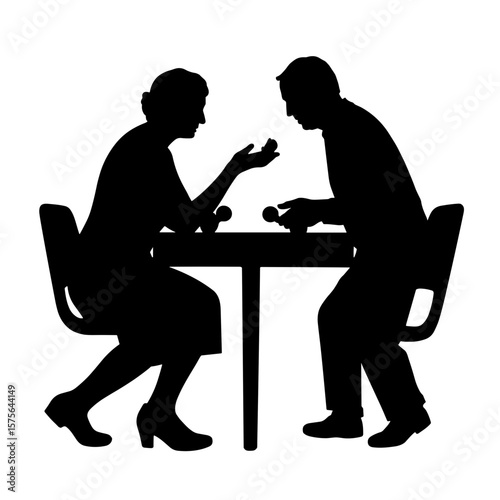 Silhouette of a man and woman sitting at a table in a serious conversation, symbol of discussion, argument, communication, relationship talk, or negotiation