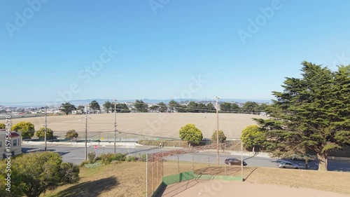 Wallpaper Mural Aerial view of Bernal Heights shows its circular summit and panoramic backdrop of city towers and bay waters. Torontodigital.ca