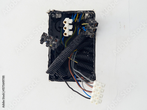 Cable junction box in a plasterboard wall