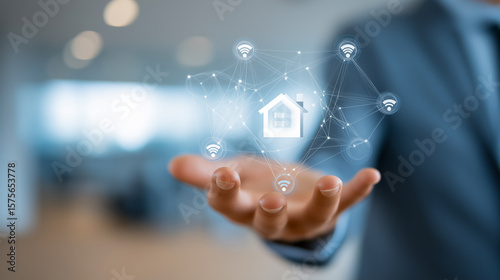 Businessman holding in his hand the smart home icon with connected nodes