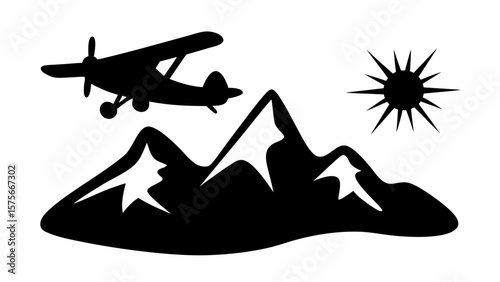 Silhouette of a small airplane flying over snowy mountains with a shining sun in the background view scene