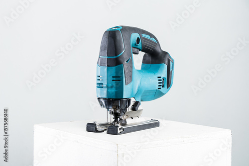 Isolated photo of a cordless jigsaw machine, on white background.