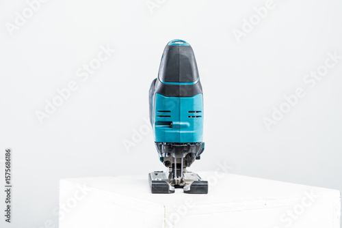 Isolated photo of a cordless jigsaw machine, on white background.