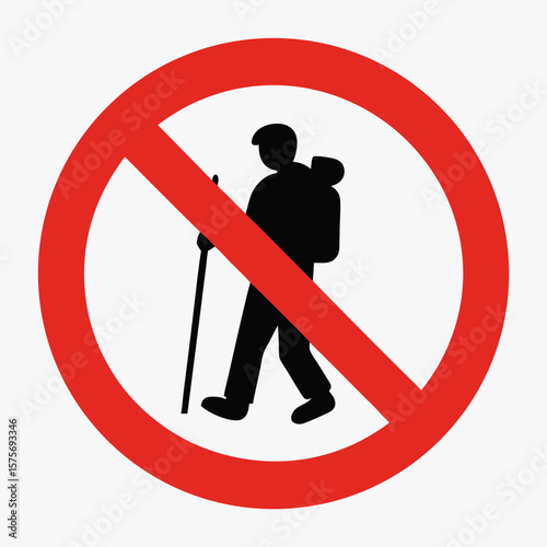 No climbing sign with silhouette of hiker and red prohibition circle. Restrictions in climbing areas depicted by warning sign, showcasing hiker with backpack and trekking pole.