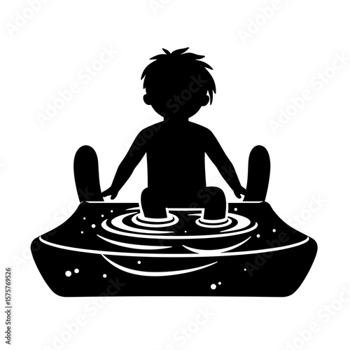 Silhouette of child sliding down water slide, playful summer fun