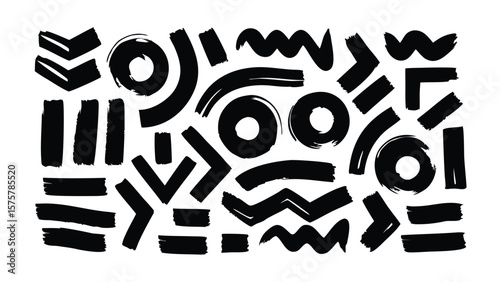 Collection of abstract black brush strokes and shapes on a white background in various orientations
