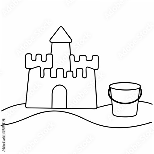 Sandcastle and bucket on beach summer vacation