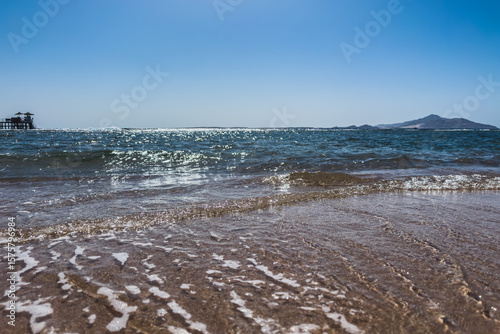 Sea to the horizon, pier and view of Tiran Island. Selective focus. Vacation at sea.