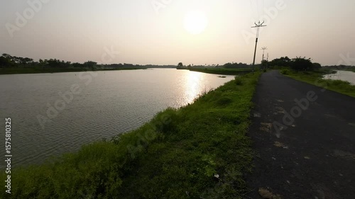 Scenic Riverside Road at Sunset in Rural India