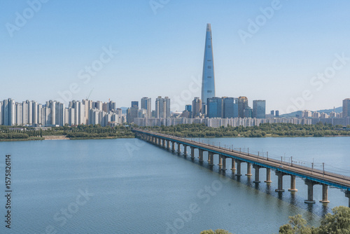Photography Beautiful view of modern tower and Jamsil Railway Bridge over the Han River (Hangang) at downtown of Seoul in South Korea