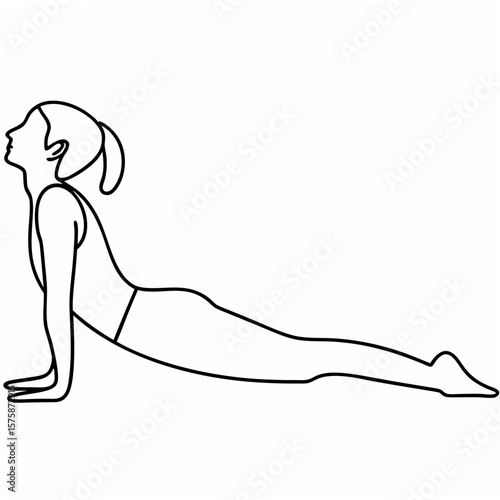 Woman performing cobra pose yoga bhujangasana stretching
