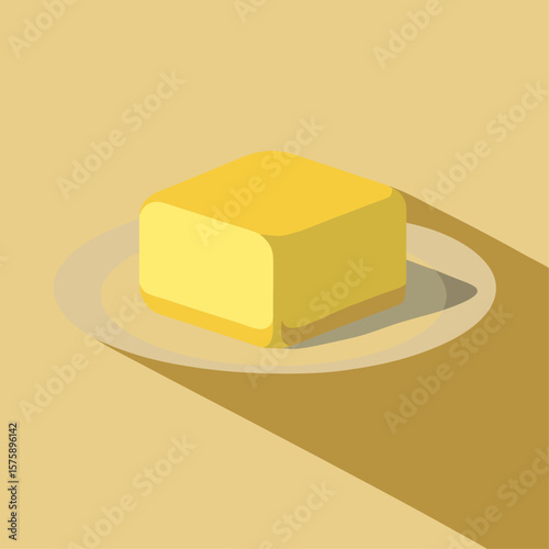 A yellow butter box is placed on a yellow plate. The butter is spread evenly on the plate, creating a visually appealing presentation. The plate is positioned on a yellow background, which adds a warm