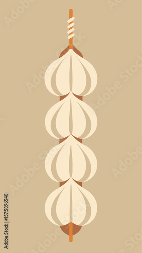 A bunch of garlic bulbs are hanging from a string. The bulbs are in a row and are all different sizes