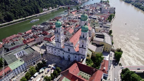 Wide aerial drone shot of St. Stephen's Cathedral, Danube and Inn River in Passau, UHD