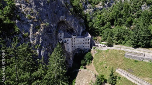 Predjama Castle, Slovenia, historical castle built into a rock wall, european history, drone shot