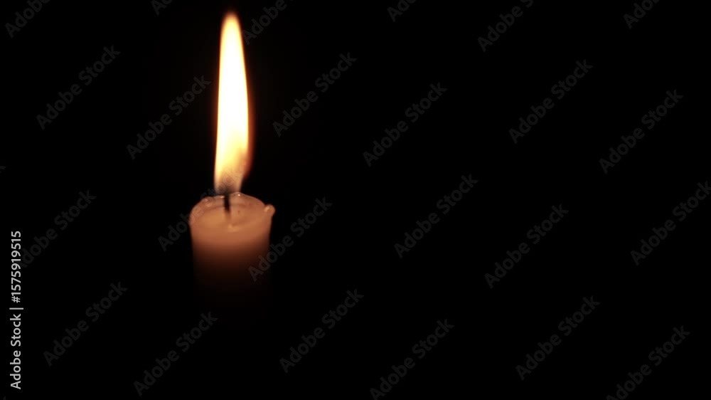 Close-Up of a Burning Candle Flame in the Dark Close-Up of a Burning Candle Flame in the Dark