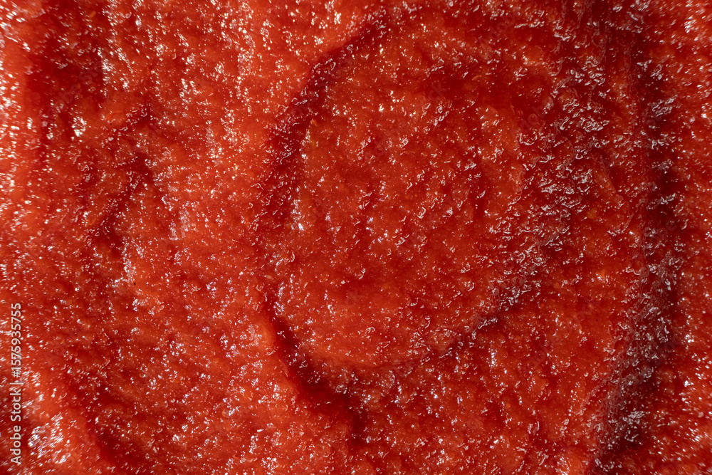 Smooth Surface of Tomato Concentrate Close-Up. Food Ingredient Detail Smooth Surface of Tomato Concentrate Close-Up. Food Ingredient Detail