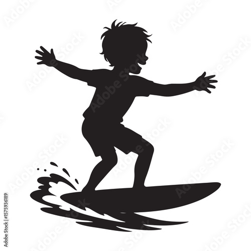 Silhouette of a young boy surfing on a surfboard with water splashing around the board in the ocean
