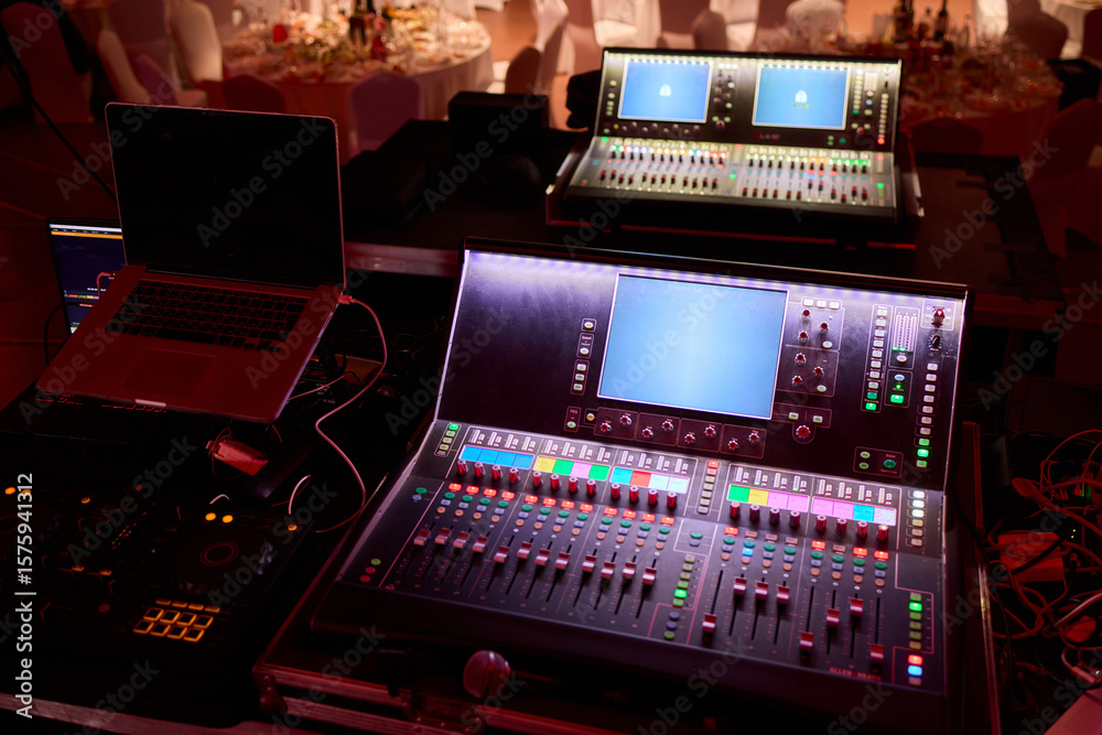 Closeup image of a hand mixing sounds on a control board, showcasing an audio technicians work Closeup image of a hand mixing sounds on a control board, showcasing an audio technicians work