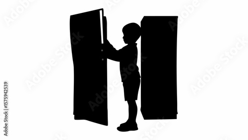Silhouette of a young boy opening a dark cabinet door with another cabinet standing beside him alone now