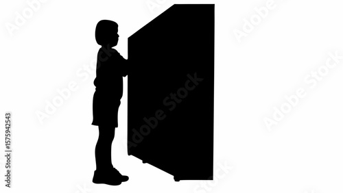 Silhouette of a child standing next to a large rectangular object in a black and white composition