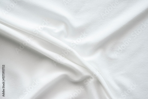 The texture of the bright white fabric is wavy and flowing, the wrinkles of the white stretch fabric.