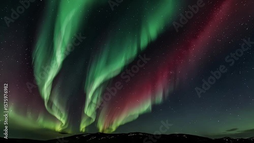The Beauty of the Northern Lights Over Dramatic Mountain Landscapes