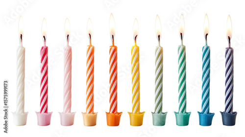 Festive arrangement of colorful birthday candles with lit flames against black background