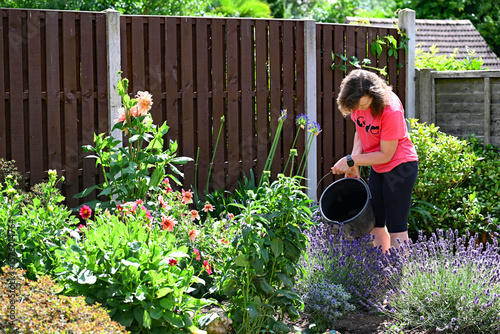 A gardener responding appropriately and caringly within the contect of global warming.