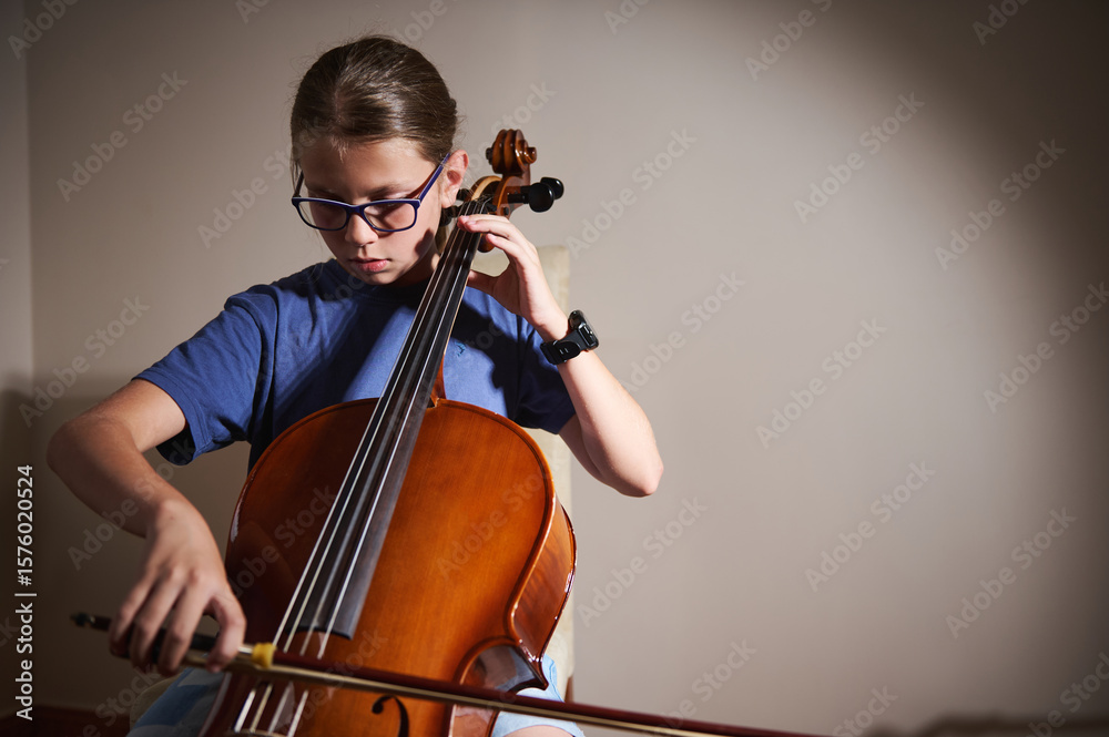 Young Musician Practicing The Cello at Home with Dedicated Focus Young Musician Practicing The Cello at Home with Dedicated Focus