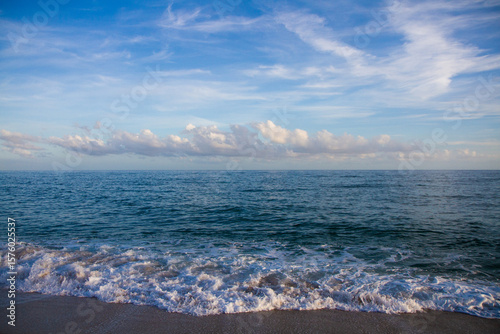 Fototapeta Naklejka Na Ścianę i Meble -  beautiful landscape on the coast of the beach and sea waves against the background of the blue sky