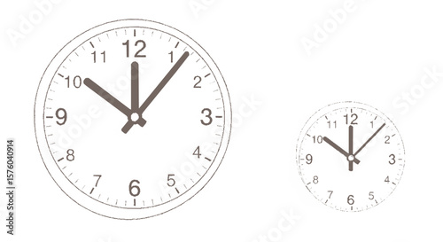 Two simple, round clocks showing the time, one slightly larger than the other.