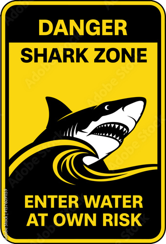 Warning sign for a shark zone, advising caution when entering the water.
