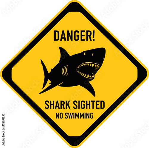 A yellow diamond-shaped warning sign displaying a shark and the message "Shark Sighted, No Swimming".