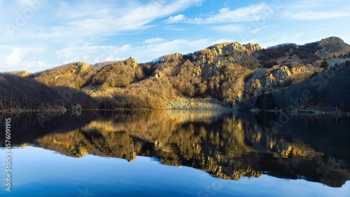 the placid waters of the Parma Holy Lake in the Apennines