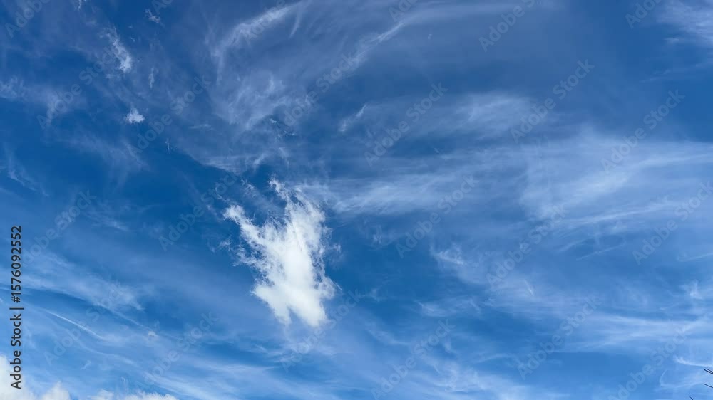 A lone cloud in the sky against the backdrop of cirrus clouds in the skies above Cape Town.