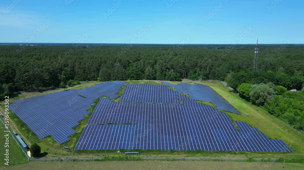 custom made wallpaper toronto digitalPhotovoltaic panels providing clean energy in a solar farm on hill near a forest in Germany. Best aerial view flight static tripod hovering drone