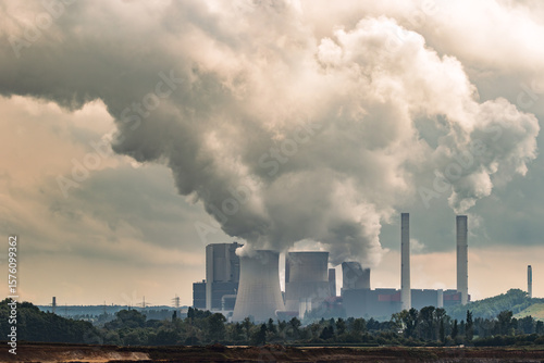 Wallpaper Mural Emissions rising from a power plant chimney, contributing to air pollution and environmental impact Torontodigital.ca