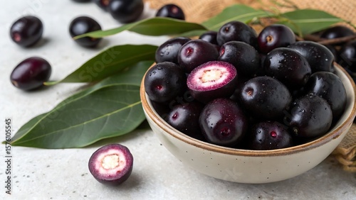 Heap of fresh Jamun berries and halved ones,food, olive, black, fruit, healthy, olives, oil, bowl, green, white, berry, ripe, sweet, fresh, isolated, diet, vegetarian, red